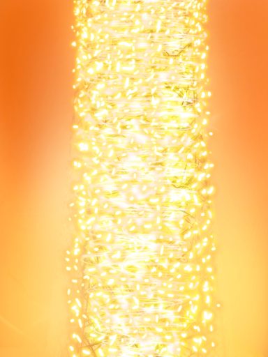 Cascada de burbujas brillantes sobre un fondo naranja cálido.